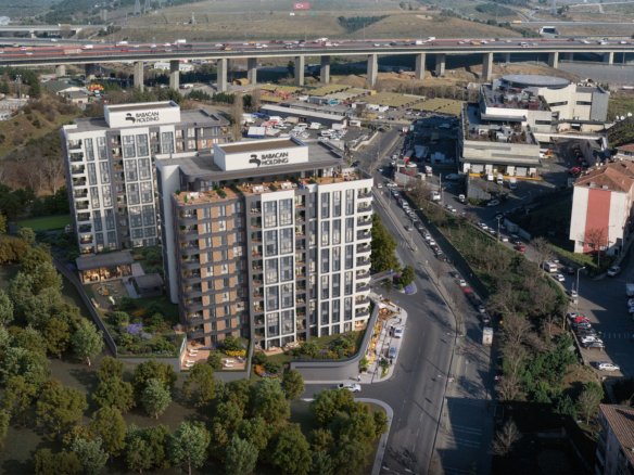 Modern residential towers of Babacan Lagoon Istanbul with illuminated balconies and landscaped gardens at twilight.